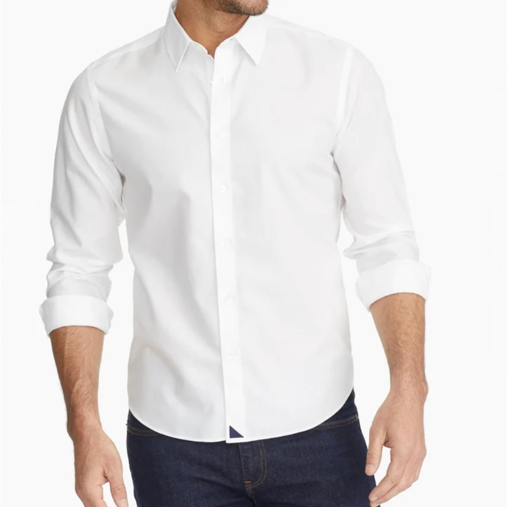 Beautiful untuckit white linen shirt with navy embroidered detail on cuffs.